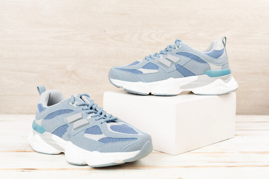Pair of sneakers on wooden background