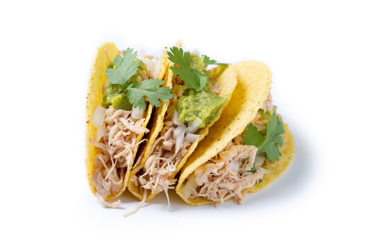 Carnitas tacos with guacamole, cilantro, onion and lime isolated on white background