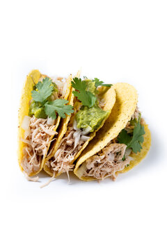 Carnitas tacos with guacamole, cilantro, onion and lime isolated on white background