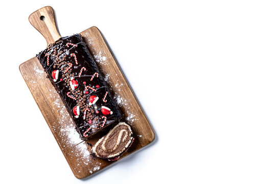 Christmas chocolate yule log cake isolated on white background. Copy space