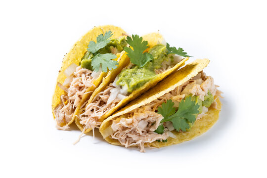 Carnitas tacos with guacamole, cilantro, onion and lime isolated on white background