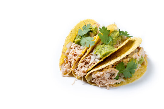 Carnitas tacos with guacamole, cilantro, onion and lime isolated on white background. Copy space