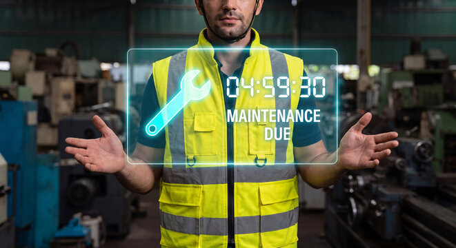 maintenance technician presents glowing equipment maintenance interface to confirm maintenance due, verify service interval, and manage repair schedule