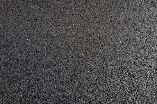 Newly Laid Black Asphalt Pavement Surface in Close Detail