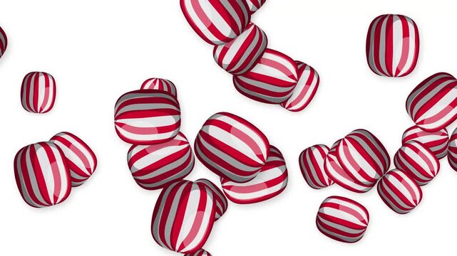 Red and White Striped Peppermint Candy Falling on White Background