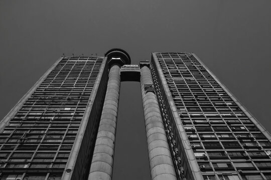 BELGRADE, SERBIA - AUGUST 24, 2026: Low angle view of the famous Genex Tower, a classic brutalist concrete skyscraper under a clear sky in New Belgrade.