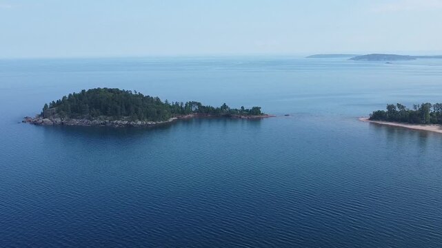 Drone shot above Lake Superior in Marquette, Michigan with islands 24fps