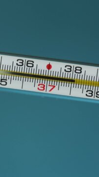 Close-up of a medical thermometer showing temperature readings