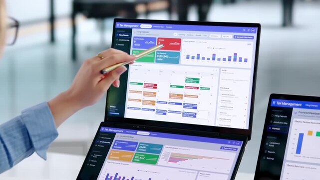 Corporate Tax Manager Reviews Compliance Dashboard Before Important