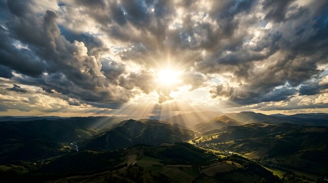 Radiant sunburst piercing through stormy clouds over mountains