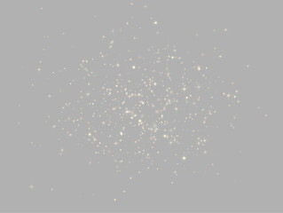 A cluster of golden starbursts glimmers softly against a black background. The delicate sparkles vary in size and intensity with a subtle warm glow. This image evokes night sky magic and is. © dedstock