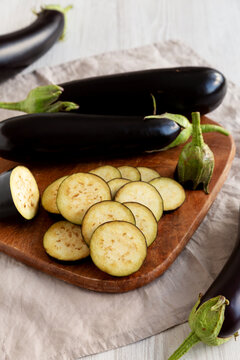 Raw Organic Eggplant on a Wooden Board