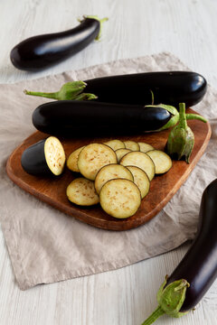 Raw Organic Eggplant on a Wooden Board