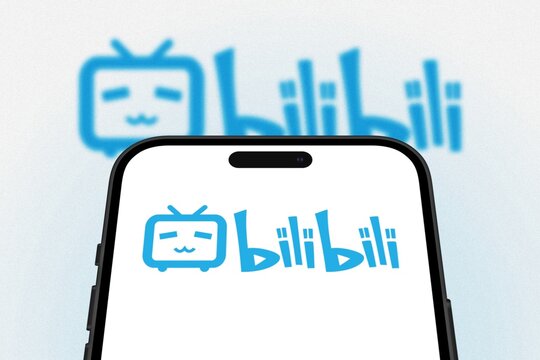 Bilibili logo is displayed on a smartphone screen