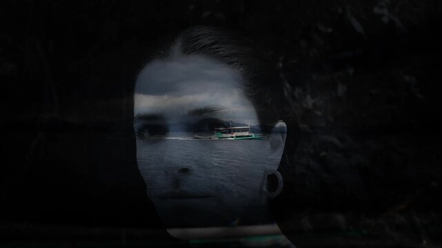 Artistic reflection of a woman&rsquo;s face over a dark tropical boat scene in Palawan.