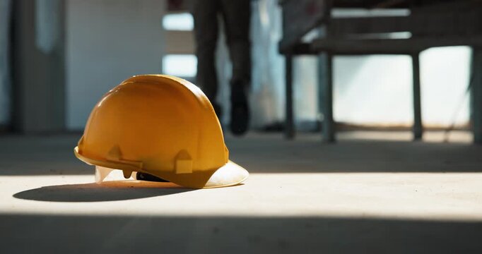 Person, building and floor with helmet for construction, renovation or architecture development. Architect, contractor or civil engineer with hard hat, safety gear or PPE protection on site or space