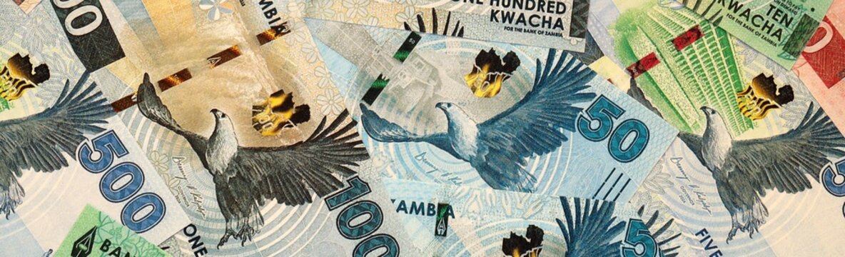 Zambian kwacha money bills in pile on table. Zambia ZMW currency cash close up