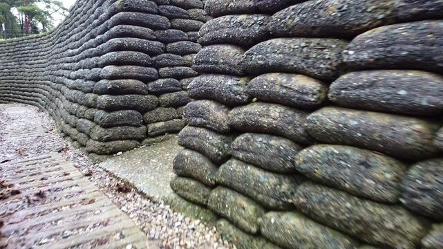 Inside a World War I trench. Walking through the trench. Military parapets made of sandbags. Canadian National Vimy Ridge Memorial. France.