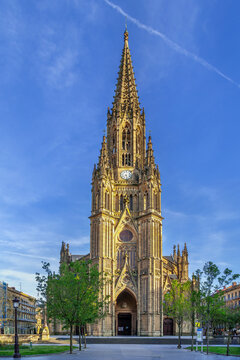 Cathedral of the Good Shepherd facade in San Sebastian, Spain. Low angle view. Sunny daylight, blue sky. Neo Gothic style