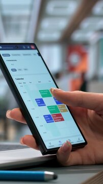 Human Resources Manager Using Laptop And Smartphone