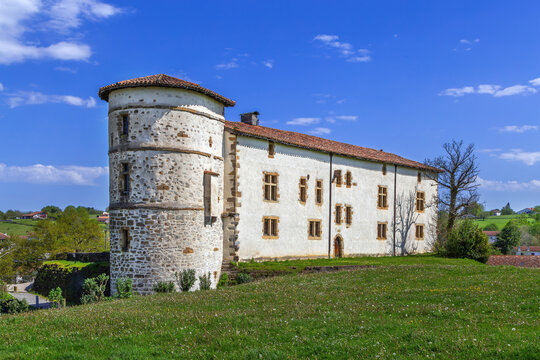 Castle of the Barons of Espelette in France. Eye level exterior view. Sunny day with blue sky. Medieval palace architecture