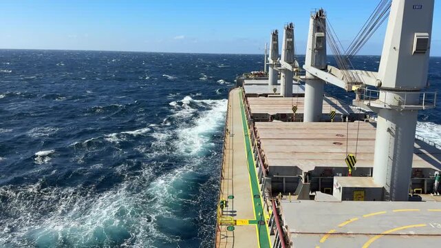 merchant vessel proceeding at rough sea with 7 Beaufort scale wind.