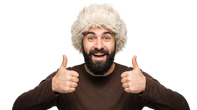 Happy Bearded Man Giving Thumbs Up in Fur Hat Isolated on White Background