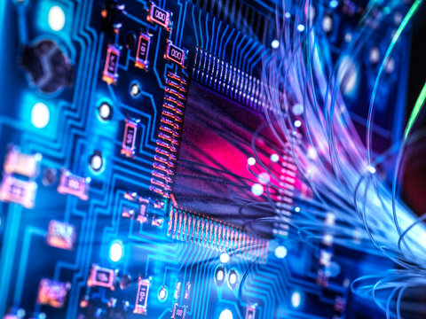 Glowing fiber optic cable on a futuristic computer circuit board