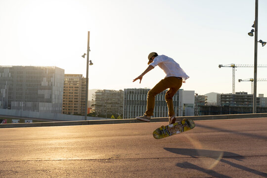 Young man riding skateboard in the city