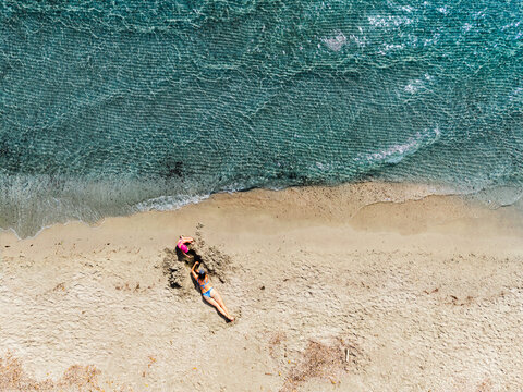 Mother and child spend summer vacation on a sandy beach