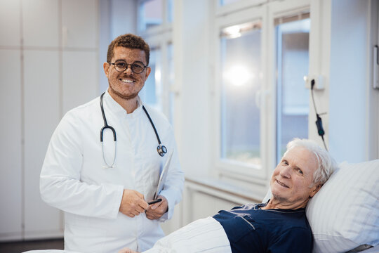Doctor with stethoscope attending patient in hospital clinic room