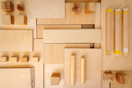 Flat lay of various wood and plywood pieces. Carpentry background.
