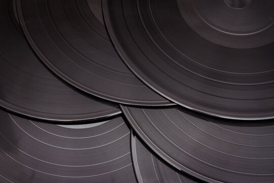Group of black vintage records. Vinyl records texture, music background. View of phonograph records.