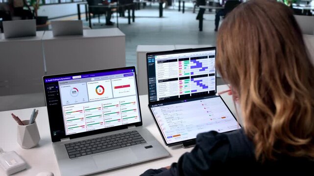 Mature Woman Uses Dual Touchscreens