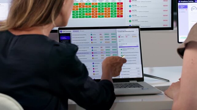 Woman Reviews Employee Training Progress On Laptop