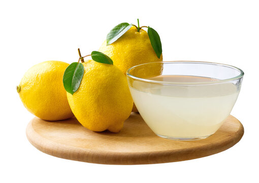 Fresh lemons fruit and bowl of lemon juice isolated on white background. freshly squeezed lemon juice.