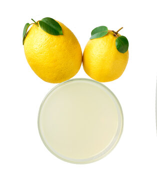Glass of freshly squeezed lemon juice isolated on white background, top view . lemon juice in glass isolated, top view.
