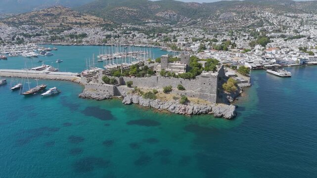 Aerial footage of Bodrum Castle and the city, Turkey. Bodrum is a town and district of Muğla Province in Turkey.	