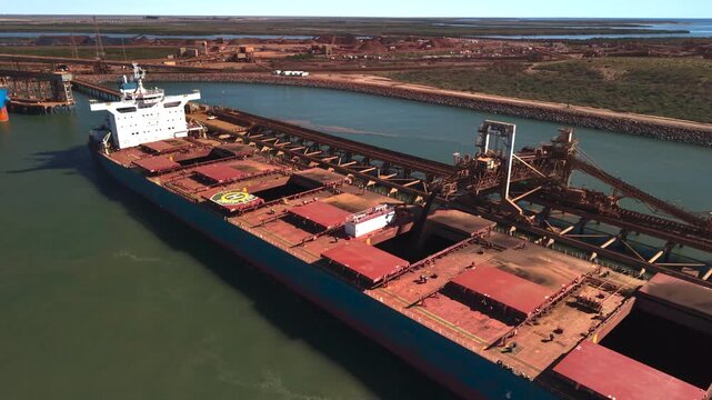 Ships being loaded with resources for international shipping Port Heldand