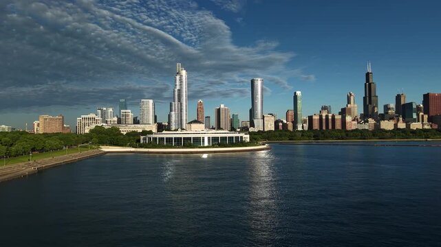 Chicao USA, Drone Shot of Shedd Aquarium Building, Skyscrapers and Towers on Golden Hour Sunlight From Lake Michigan