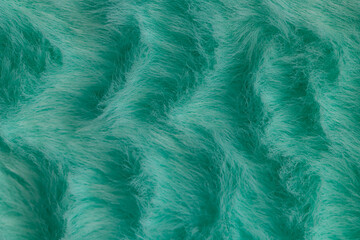 Obraz premium Macro close up of turquoise green faux fur texture background