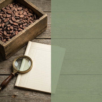 Chocolate Day Cacao Beans in Wooden Box with Magnifying Glass and Blank Notebook Page