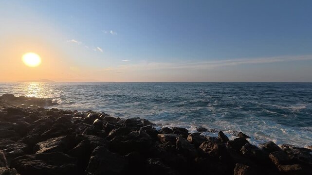 Waves crashing on the shore, as seen to the Chania lighthouse, Greece.