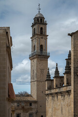 Bell tower of the Cathedral of Jerez de la Frontera in Andalusia, Spain, rising above the historic center with Gothic and Baroque architectural elements. © ihervas