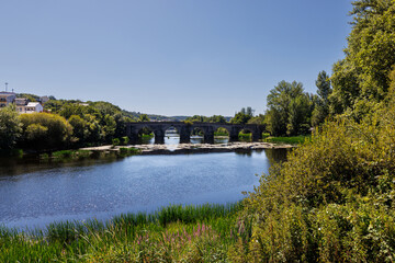 Fototapeta premium Ancient Roman stone bridge over Minho River in Lugo, Galicia,Spain