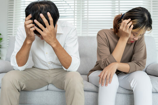 Divorce. Asian couples are desperate and disappointed after marriage. Husband and wife are sad, upset and frustrated after quarrels. distrust, love problems, betrayals. family problem, teenage love