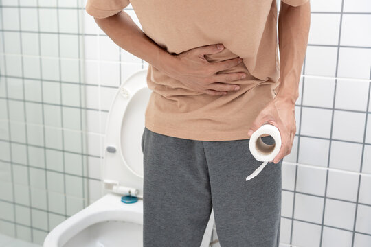 Constipation and diarrhea in bathroom. Hurt man touch belly  stomach ache painful. colon inflammation problem, toxic food, abdominal pain, abdomen, constipated in toilet, stomachache, Hygiene