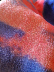 Abstract tie-dye fleece blanket texture with soft fluffy pile © Diana
