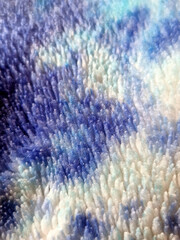 Abstract tie-dye fleece blanket texture with soft fluffy pile © Diana