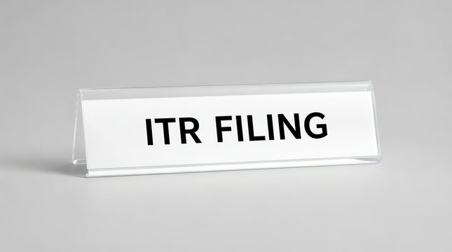 A clear office desk name plate displaying the text ITR filing, representing tax return submission and financial obligation